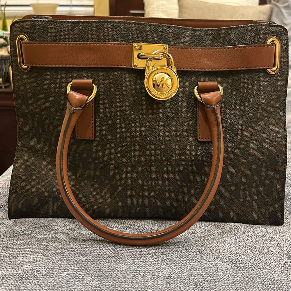 Michael Kors brown signature print leather handbag.